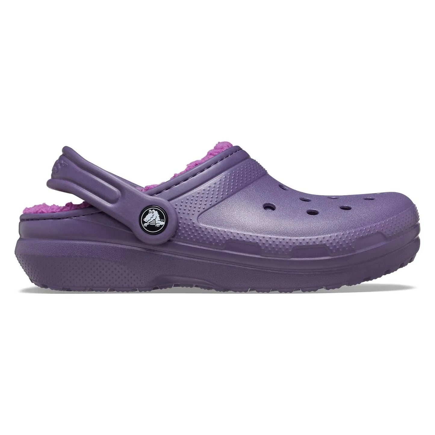 Πλάγια όψη του παιδικού Crocs Lined Clog T σε χρώμα Nightshade, με εμφανές το λουράκι φτέρνας και τη μαλακή fleece επένδυση.